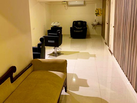 The salon, chairs along the mirrored wall