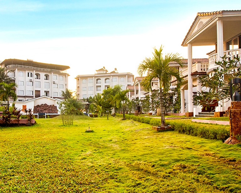 Open lawn running down toward the water