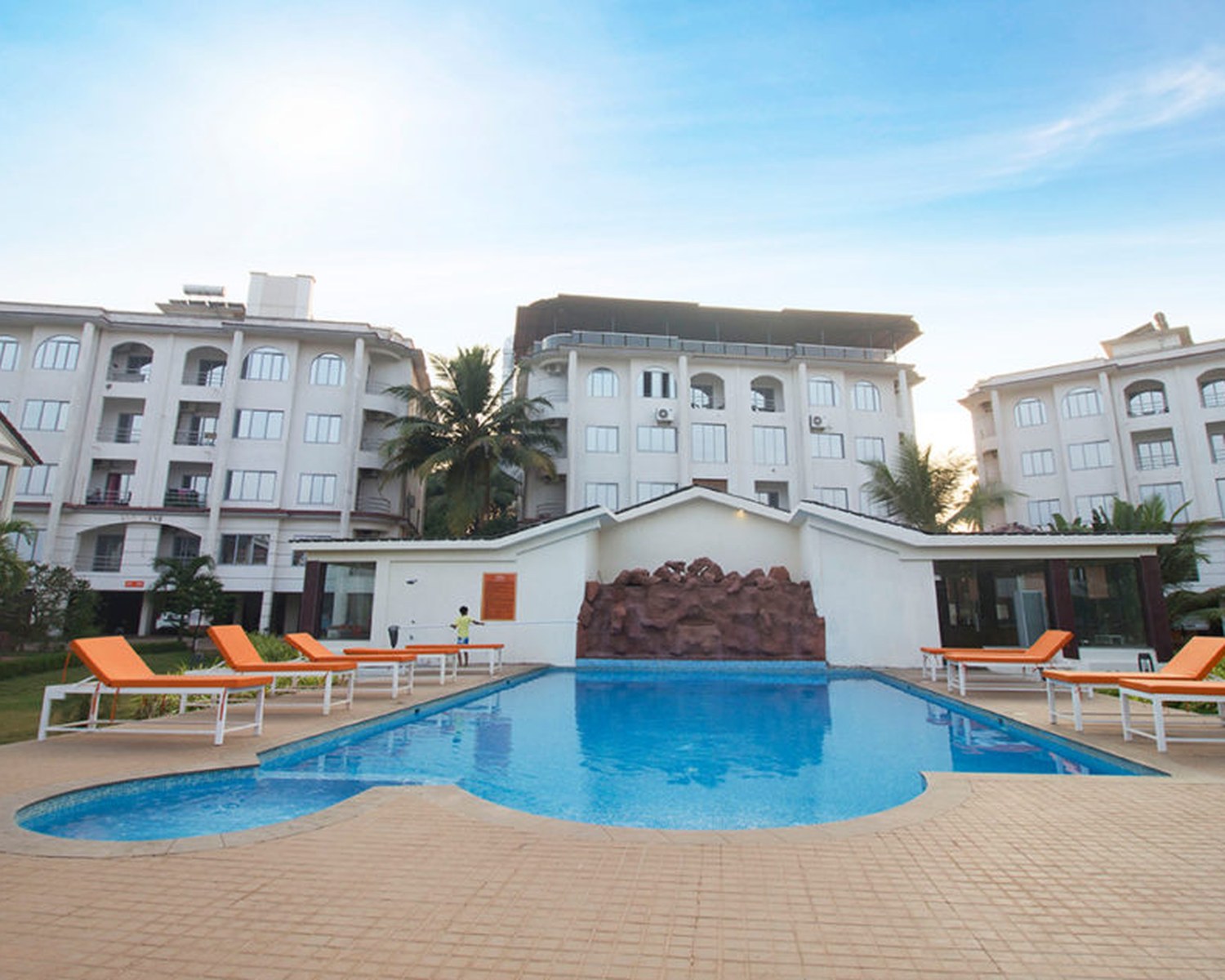 The pool deck between the blocks and the restaurant